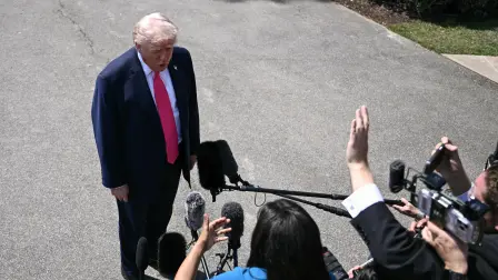US President Donald Trump speaks to reporters before walking to board Marine One as he departs from the South Lawn of the White House in Washington, DC, on April 16, 2026. Trump is headed to Las Vegas where he will deliver remarks on his "no tax on tips" policy. (Photo by Brendan SMIALOWSKI / AFP)