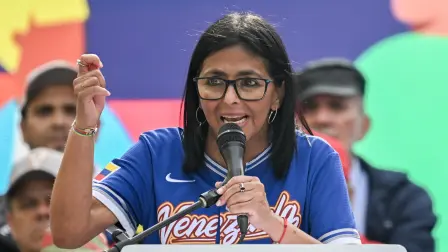 Venezuela's acting president Delcy Rodriguez speaks during a march calling for the lifting of all US sanctions in Caracas on April 30, 2026. Delcy Rodriguez announced on April 30 a 26% wage increase to the so-called "integral minimum income," raising it from 190 dollars to 240 dollars per month, the first adjustment since Nicolas Maduro's fall. (Photo by Juan BARRETO / AFP)