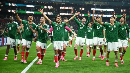 Mexico's players celebrate after winning the 2026 World Cup round of 32 football match between Mexico and Ecuador at the Mexico City Stadium in Mexico City on June 30, 2026.  (Photo by YURI CORTEZ / AFP)