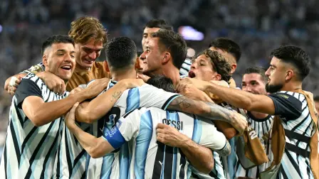 Argentina's defender #13 Cristian Romero celebrates with teammates scoring his team's third goal during the 2026 World Cup round of 32 football match between Argentina and Cape Verde at the Miami Stadium in Miami Gardens on July 3, 2026.  (Photo by CHANDAN KHANNA / AFP)