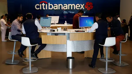 Personal bankers speak to customers inside a Citibanamex branch in Mexico City - Personal bankers speak to customers inside a Citibanamex branch in Mexico City, Mexico May 8, 2017. Picture taken May 8, 2017. REUTERS/Henry Romero