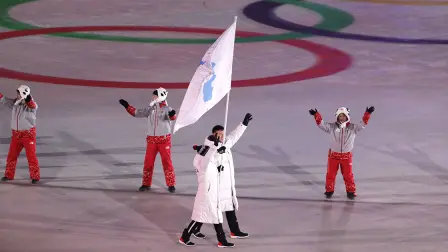 Pyeongchang 2018 Winter Olympics - Pyeongchang 2018 Winter Olympics â€“ Opening ceremony â€“ Pyeongchang Olympic Stadium - Pyeongchang, South Korea â€“ February 9, 2018 - Hwang Chung Gum and Won Yunjong of Korea carrie the unification flag during the opening ceremony. REUTERS/Kim Kyung-Hoon