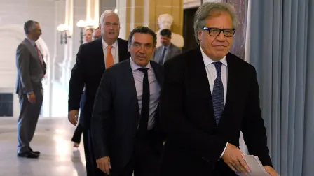 The Organization of American States (OAS) holds a news conference in Washington - REFILE - QUALITY REPEAT  Manuel Ventura Robles, Santiago Canton and OAS General Secretary Luis Almagro arrive to participate in the Organization of American States (OAS) news conference with a panel of independent international experts, who will present their conclusions and recommendations on "whether crimes against humanity have been committed in Venezuela", in Washington, U.S., May 29, 2018. REUTERS/Mary F. Calvert