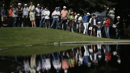 Spectators watch across a lake at the 6th hole, during round one of the Mexico Championship at Chapultepec Golf Club in Mexico City, Thursday, March 2, 2017. All but one of the world