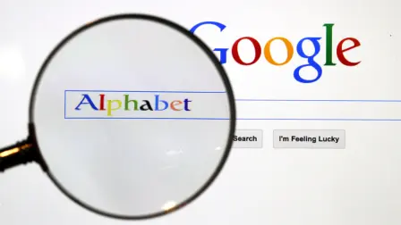FILE PHOTO: A Google search page is seen through a magnifying glass in this photo illustration taken in Berlin