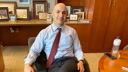 Minneapolis Federal Reserve Bank President Neel Kashkari poses during an interview with Reuters in his office at the bank