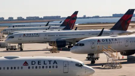 FILE PHOTO: Delta planes are seen at the platform after the Federal Aviation Administration (FAA) temporarily halted flights arriving at New York City airports due to coronavirus disease (COVID-19) in New York