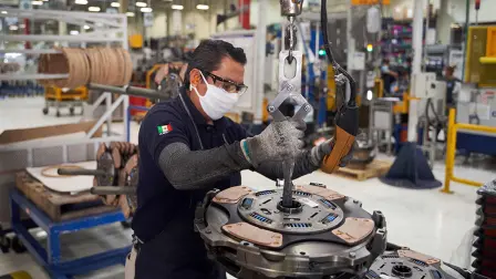 A worker resumes activities at a truck part factory after it was closed for several weeks to prevent the spread of coronavirus in San Luis Potosi, Mexico on May 27, 2020. (Photo by MAURICIO PALOS / AFP)