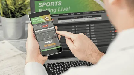 Betting,Bet,Sport,Phone,Gamble,Laptop,Over,Shoulder,Soccer,Live