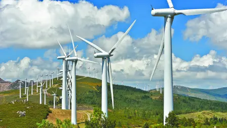 Windmill-powered,Plant,On,Hilltop,In,Europe
