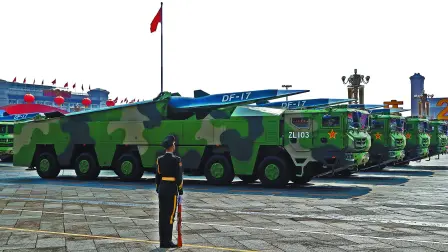 FILE PHOTO: Military vehicles carrying hypersonic missiles DF-17 drive past Tiananmen Square during the military parade marking the 70th founding anniversary of People