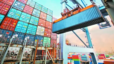 Container,Loading,In,A,Cargo,Freight,Ship,With,Industrial,Crane.