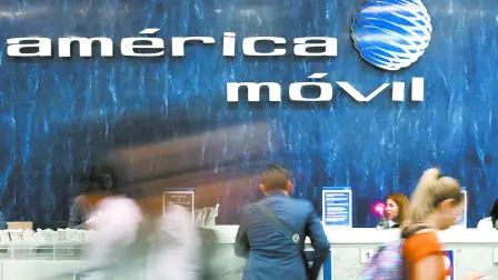 FILE PHOTO: The logo of America Movil is pictured on the wall of a reception area in the company's corporate offices in Mexico City, Mexico, May 18, 2017. REUTERS/Edgard Garrido/File Photo-NARCH/NARCH30