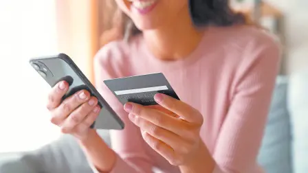 Close,Up,Smiling,Millennial,Woman,Holding,Smartphone,And,Banking,Credit