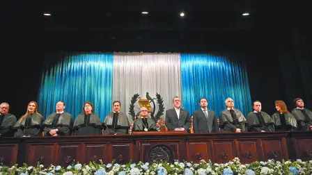 The new President of the Supreme Court of Justice, Carlos Lucero (5th-L), and Guatemalan President Bernardo Arevalo (5th-R) are seen during a ceremony where new judges take office at the Teatro Nacional Miguel Angel Asturias in Guatemala City on October 13, 2024. The new judges of the Supreme Court of Guatemala take office this Sunday amid doubts about their probity, after a selection process questioned for its lack of transparency. (Photo by JOHAN ORDONEZ / AFP)