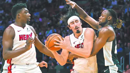 Oct 15, 2024; Miami, Florida, USA; Miami Heat guard Jaime Jaquez Jr. (11) drives to the basket against San Antonio Spurs center Charles Bassey (28) during the third quarter at Kaseya Center. Mandatory Credit: Sam Navarro-Imagn Images