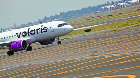 A Volaris airplane is pictured on the airstrip at Benito Juarez international airport in Mexico City, Mexico, May 9, 2022. REUTERS/Edgard Garrido