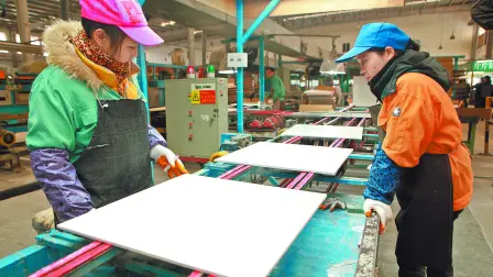 JIUJIANG CHINA-Dec 4, 2012:Jiujiang light industrial enterprises Nobel Ceramics Co., Ltd. production workshop, the workers are building ceramic tile products, products exported to Southeast asia.