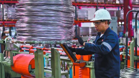 An employee works inside a stainless steel manufacturing plant, in Tlaxcala, Mexico, February 11, 2025. REUTERS/Hector Lorenzo