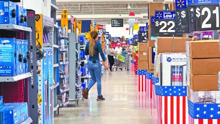 People walk at a Walmart store in  Oceanside, California, U.S., May 15, 2025. REUTERS/Mike Blake