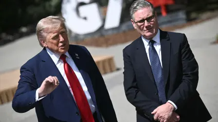 US President Donald Trump (L) and British Prime Minister Keir Starmer speak to reporters after meeting during the Group of Seven (G7) Summit at the Pomeroy Kananaskis Mountain Lodge in Kananaskis, Alberta, Canada on June 16, 2025. (Photo by Brendan SMIALOWSKI / AFP)