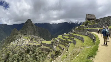 (FILES) Tourists visit the ancient Inca ruins of Machu Picchu in the Urubamba valley, seventy-two kilometres from the Andes city of Cusco, on February 15, 2023, for the first time after they were closed to the public for security reasons on January 21, after protesters blocked the railways during protests against the government of President Dina Boluarte that have shaken the Andean country since December 7, 2022. The train service to Machu Picchu, Peru's main tourist attraction, had to be suspended on September 15, 2025, due to a protest by residents demanding that a new company handle the bus transportation from the train station to the archaeological site, following the end of a 30-year concession, the operating company reported. (Photo by Carolina Paucar / AFP)