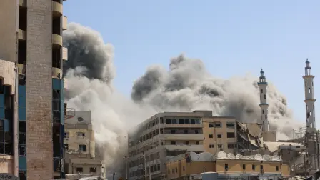 Smoke billows as Israeli airstrikes destroy the al-Ghafari tower in Gaza City on September 15, 2025. Israel's military had said on September 9 that it will act with 