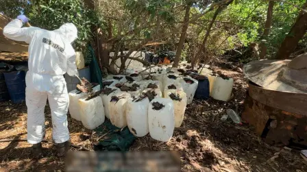 This handout picture released by the Mexican Navy on July 18, 2025 shows a soldier working to dismantle an alleged clandestine methamphetamine laboratory at an undetermined location in Sinaloa state, Mexico. Mexican authorities seized 4.8 tons of methamphetamines and dismantled six clandestine drug manufacturing laboratories following an operation in the violent state of Sinaloa, the Navy Secretariat announced on July 18, 2025. (Photo by Handout / Mexican Navy / AFP) / RESTRICTED TO EDITORIAL USE - MANDATORY CREDIT "AFP PHOTO / MEXICAN NAVY" - HANDOUT - NO MARKETING NO ADVERTISING CAMPAIGNS - DISTRIBUTED AS A SERVICE TO CLIENTS