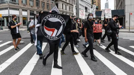 NEW YORK, NY - JULY 25: Left wing protesters, some affiliated with Antifa, hold a counter protest against right wing protesters participating in a political rally on July 25, 2021 in New York City. Right wing protesters were demanding a release of the people who were arrested on January 6th for their involvement in the breach of the Capitol building.   Stephanie Keith/Getty Images/AFP (Photo by STEPHANIE KEITH / GETTY IMAGES NORTH AMERICA / Getty Images via AFP)