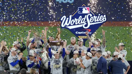 TORONTO, ONTARIO - NOVEMBER 02: Yoshinobu Yamamoto #18 of the Los Angeles Dodgers raises the Willie Mays World Series Most Valuable Player Award after defeating the Toronto Blue Jays 5-4 in game seven of the 2025 World Series at Rogers Center on November 02, 2025 in Toronto, Ontario.   Mark Blinch/Getty Images/AFP (Photo by MARK BLINCH / GETTY IMAGES NORTH AMERICA / Getty Images via AFP)