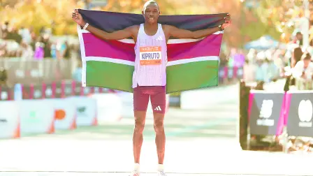 NEW YORK, NEW YORK - NOVEMBER 02: Benson Kipruto of Kenya poses with a flag after the Professional Menís Open Division during the 2025 TCS New York City Marathon on November 02, 2025 in New York City.   Ishika Samant/Getty Images/AFP (Photo by Ishika Samant / GETTY IMAGES NORTH AMERICA / Getty Images via AFP)