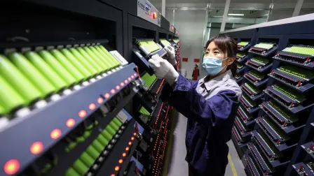 The photo taken on April 26, 2025 shows an employee working on a lithium battery production line at a factory in Huaibei, in eastern China's Anhui province. (Photo by AFP) / China OUT / CHINA OUT