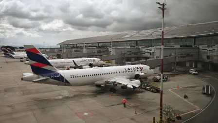 LATAM airline planes are pictured on the tarmac at El Dorado International Airport in Bogota on May 19, 2025. Venezuela's government said Monday it had suspended flights arriving from neighboring Colombia after what it called a cross-border infiltration of 