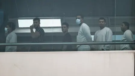 Venezuelan migrants walk after their arrival on an Eastern Airlines plane from the US at Simon Bolivar International Airport in Maiquetia, Venezuela, on December 3, 2025. Venezuela announced on December 2, 2025, that it had reauthorized flights carrying migrants deported by the US, days after suspending them due to President Donald Trump's demand that Venezuelan airspace be considered 