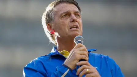 (FILES) Brazil's former President Jair Bolsonaro speaks during a rally on Paulista Avenue in Sao Paulo, Brazil, on June 29, 2025. Former Brazilian President Jair Bolsonaro, who is serving a 27-year prison sentence for an attempted coup, underwent medical treatment on December 27, 2025, for the hiccups he has been suffering from for months. (Photo by Miguel SCHINCARIOL / AFP)