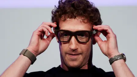FILE PHOTO: FILE PHOTO: Meta CEO Mark Zuckerberg wears the Meta Ray-Ban Display glasses, as he delivers a speech presenting the new line of smart glasses, during the Meta Connect event at the company's headquarters in Menlo Park, California, U.S., September 17, 2025. REUTERS/Carlos Barria     TPX IMAGES OF THE DAY/File Photo/File Photo