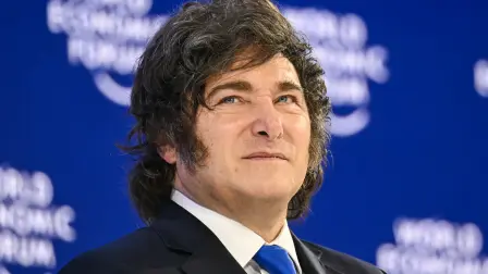 Argentinas President Javier Milei looks on during the World Economic Forum (WEF) annual meeting in Davos on January 21, 2026. The World Economic Forum takes place in Davos from January 19 to January 23, 2026. (Photo by Fabrice COFFRINI / AFP)