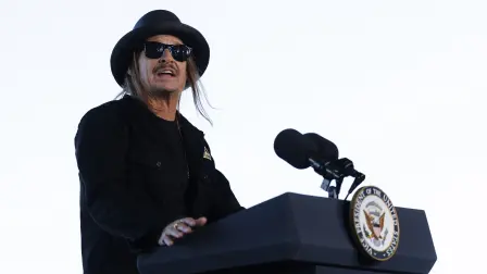 FORT CAMPBELL, KENTUCKY - NOVEMBER 26: Musician Kid Rock introduces U.S. Vice President JD Vance to speak in front of members of the US Military on November 26, 2025 in Fort Campbell, Kentucky. The Vice President visited Fort Campbell to serve a Thanksgiving meal to service members ahead of the holiday.   Brett Carlsen/Getty Images/AFP (Photo by Brett Carlsen / GETTY IMAGES NORTH AMERICA / Getty Images via AFP)