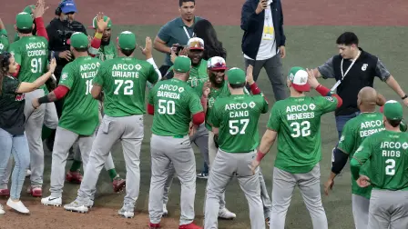 Players Tomateros de Culiacan celebrate at the end of the ninth inning of the Caribbean Series baseball tournament semi-final game between Mexico's Tomateros de Culiacan and Dominican Republic's Leones del Escogido at the Panamerican Stadium in Jalisco, Mexico, on February 6, 2026. (Photo by Ulises Ruiz / AFP)