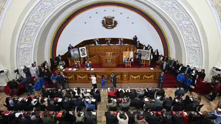 Lawmakers of Venezuela's National Assembly attend a debate on an amnesty bill proposed by Venezuela's interim president Delcy Rodriguez at the National Assembly in Caracas on February 19, 2026. Venezuela's Parliament resumed on February 19 the debate on an amnesty bill that could free hundreds of political prisoners. (Photo by Federico PARRA / AFP)