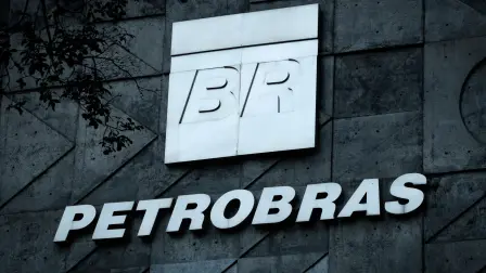 (FILES) A logo of Brazilian oil company Petrobras is seen at the entrance of its headquarters in Rio de Janeiro, Brazil, on July 15, 2016. Brazilian state-owned giant oil company Petrobras tripled its profits in 2025 compared to the previous year, driven by record oil and gas production, according to the company's annual results released on March 5, 2026. (Photo by YASUYOSHI CHIBA / AFP)