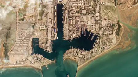 This handout satellite image taken by 2026 Planet Labs PBC shows damage at the military harbour in Iran's southern port of Bandar Abbas along the Strait of Hormuz on March 4, 2026. The United States and Israel launched strikes against Iran on February 28, with the killing of Iran's supreme leader and the Islamic republic retaliated with barrages of missiles at Gulf states and Israel. (Photo by 2026 Planet Labs PBC / AFP) / RESTRICTED TO EDITORIAL USE - MANDATORY CREDIT "AFP PHOTO / (C) 2026 PLANET LABS PBC " - HANDOUT - NO MARKETING NO ADVERTISING CAMPAIGNS - DISTRIBUTED AS A SERVICE TO CLIENTS