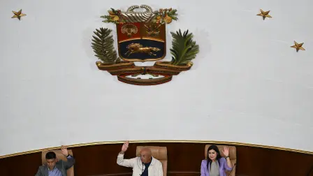 Venezuela's National Assembly President Jorge Rodriguez (C) speaks next to First Vice President Pedro Infante (L), and Second Vice President America Perez during the first session of a new mining law debate at the National Assembly in Caracas on March 9, 2026. Venezuela begins debate on a new mining law on Marc 9, 2026, that seeks to attract foreign capital, amid renewed relations with the US following the fall of Nicolas Maduro. (Photo by Juan BARRETO / AFP)
