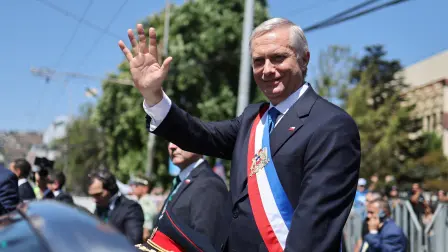 Chile's new President Jose Antonio Kast waves from the presidential convertible car after his inauguration ceremony in Valparaiso, Chile, on March 11, 2026. Chile's most right-wing president in over three decades, Jose Antonio Kast, takes office on March 11, 2026, on a promise to tackle surging rates of violent crime and carry out mass migrant deportations. (Photo by Javier TORRES / AFP)