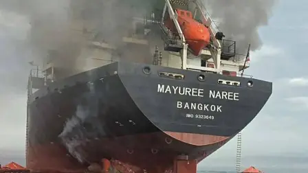 This handout photo taken on March 11, 2026 and released by the Royal Thai Navy shows smoke rising from the Thai bulk carrier 'Mayuree Naree' near the Strait of Hormuz after an attack. A Thai bulk carrier travelling in the crucial Strait of Hormuz was attacked March 11, with 20 crew members rescued so far, the Thai navy said. (Photo by Handout / ROYAL THAI NAVY / AFP) / -----EDITORS NOTE --- RESTRICTED TO EDITORIAL USE - MANDATORY CREDIT "AFP PHOTO / ROYAL THAI NAVY " - NO MARKETING - NO ADVERTISING CAMPAIGNS - DISTRIBUTED AS A SERVICE TO CLIENTS -