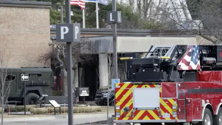 Law enforcement remain on site at the Temple Israel synagogue in West Bloomfield, Michigan, a Detroit suburb, on March 12, 2026, after an assailant drove a vehicle into the building. An unidentified assailant was dead after ramming his pickup truck on Thursday into a synagogue on the outskirts of Detroit, Michigan, and causing a blaze, police said. (Photo by JEFF KOWALSKY / AFP)