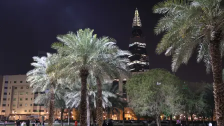 Saudis walk past King Fahad Library in the Saudi capital Riyadh City on March 12, 2026. The oil-rich gulf has borne the brunt of Iran's attack in response to US-Israel strikes that sparked the Middle East war, with Tehran targeting US assets but also civilian infrastructure, including energy facilities and airports. (Photo by AFP) /