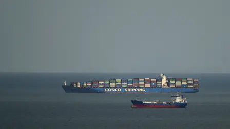 A cargo ship from the Chinese shipping company COSCO waits to transit the Panama Canal on the Pacific side, in Panama City on March 13, 2026. On March 13, the Panamanian government asked the Chinese shipping company Cosco to reconsider its decision to cease operations at a port on the Panama Canal, whose concession to the Hong Kong-based company CK Hutchison Holdings had been revoked by the Panamanian courts. (Photo by MARTIN BERNETTI / AFP)