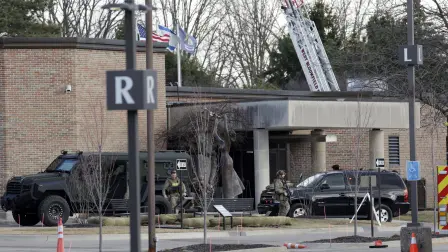 Law enforcement remain on site at the Temple Israel synagogue in West Bloomfield, Michigan, a Detroit suburb, on March 12, 2026, after an assailant drove a vehicle into the building. An unidentified assailant was dead after ramming his pickup truck on Thursday into a synagogue on the outskirts of Detroit, Michigan, and causing a blaze, police said. (Photo by JEFF KOWALSKY / AFP)