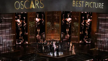 US filmmaker Paul Thomas Anderson and US producer Sara Murphy accept the award for Best Picture for "One Battle After Another" alongside cast and crew onstage during the 98th Annual Academy Awards at the Dolby Theatre in Hollywood, California on March 15, 2026. (Photo by Patrick T. Fallon / AFP)